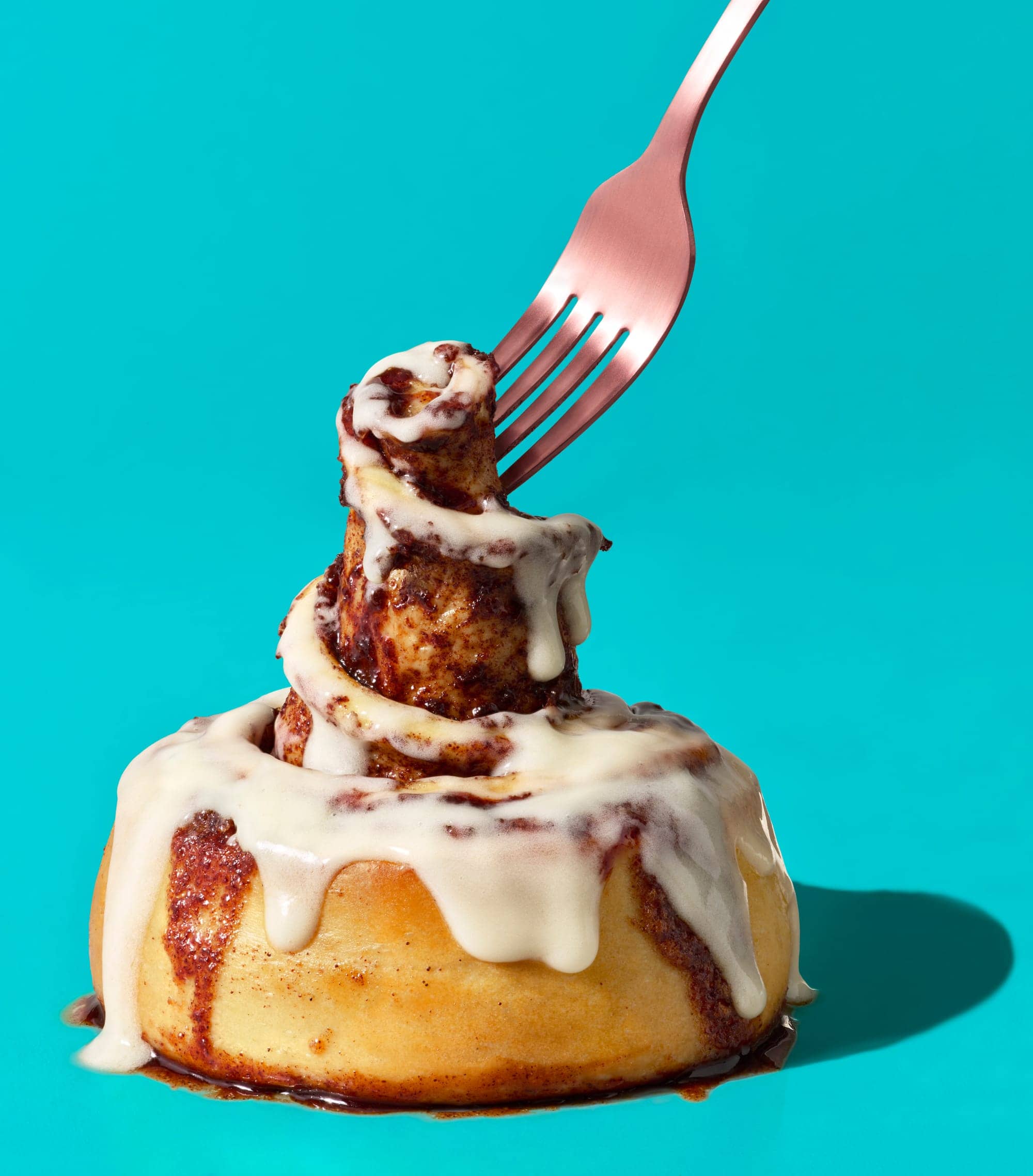 https://d3n2401vhvcfv5.cloudfront.net/_images/company/cinnabon/1734645944102-Cinnabon_ClassicRoll_ForkBite copy.jpg